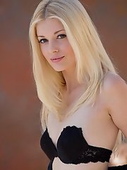 It's too beautiful out to just sit inside, and far too gorgeous of a day for Charlotte Stokely to keep her clothes on. There's a stiff wind 